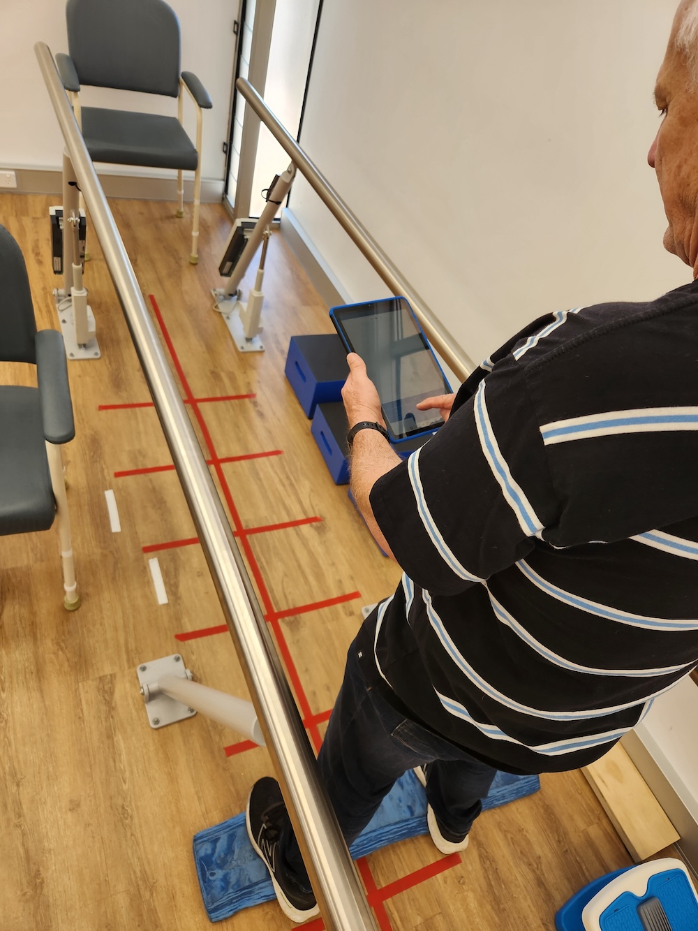 balance-training-post-concussion A patient performing balance training exercises as part of their post-concussion physiotherapy treatment