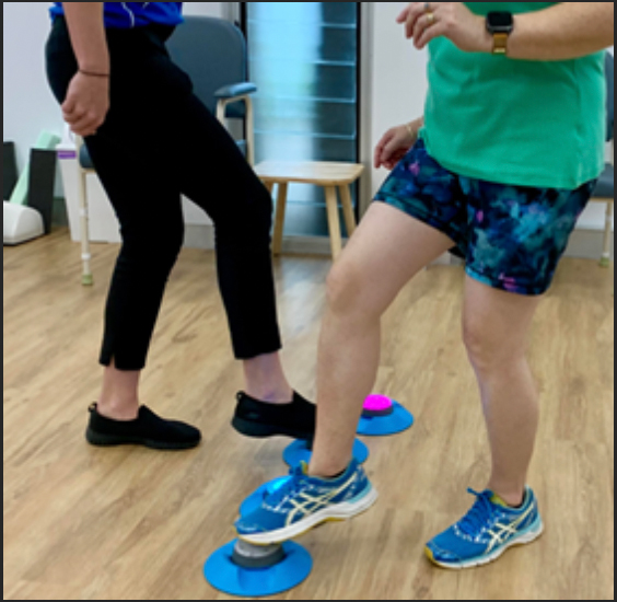 dystonia-movement-disorder-therapy-sunshine-coast Physiotherapist assisting a dystonia patient with neurological rehabilitation exercises on the Sunshine Coast